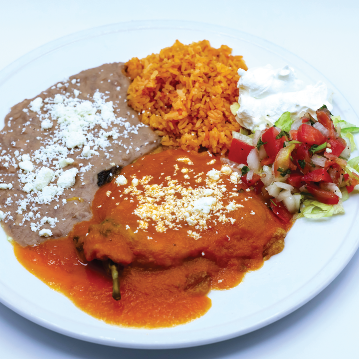 Cheese stuffed pepper smothered in red sauce and queso. Served with beans with cheese, rice, sour cream and pico de gallo at Los Altos Breakfast and Lunch.